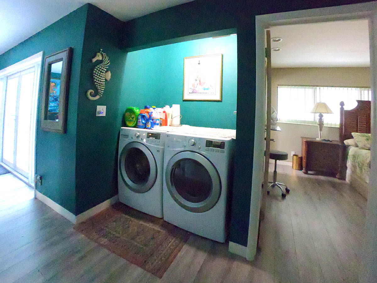 New LG Front Loading Washer and Dryer (plus cleaning supplies) are near linen closed and Master Suite